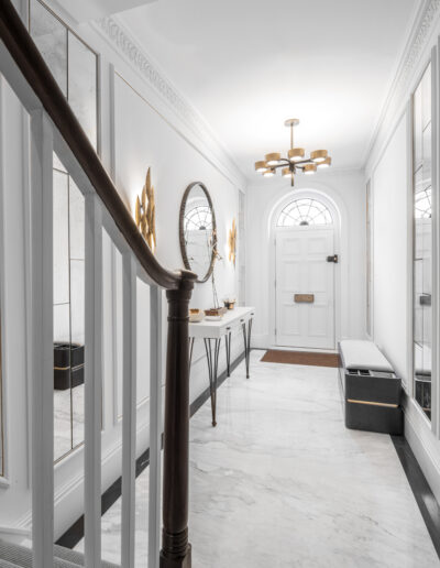 Bookmatched Calacatta marble flooring with Pietra Grey border in luxury London hallway – Montpelier Square project designed by Rigby & Rigby and Taylor Howes