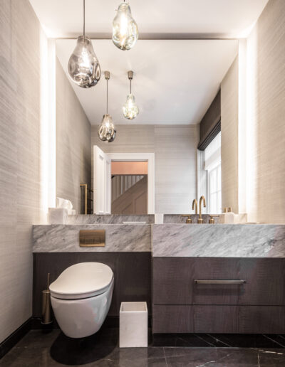 Luxury powder room with Aqua Marina marble vanity top and integrated stone basin with Pietra Grey marble floor – Montpelier Square London project by Rigby & Rigby