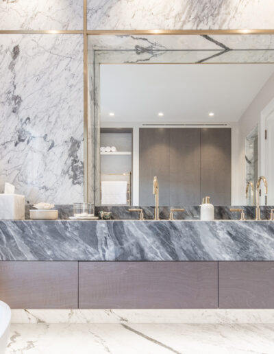 Bardiglio marble vanity with brass fixtures in luxury bathroom Montpelier Square London