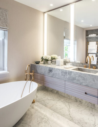 Luxury bathroom with Carrara Venatino marble flooring and Silver Emperador marble vanity – Montpelier Square London project by Rigby & Rigby