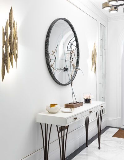 Luxury hallway with bookmatched Calacatta marble flooring and Pietra Grey border in Montpelier Square London residence designed by Rigby & Rigby