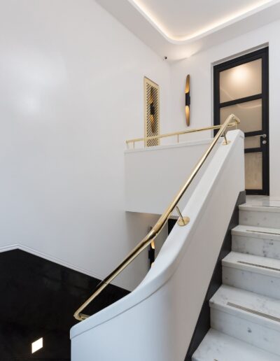 Calacatta Michelangelo marble staircase with brass handrail luxury London residence