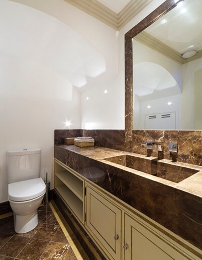 Maroon Emperador marble powder room vanity and floor Chelsea London Marble Bros LTD