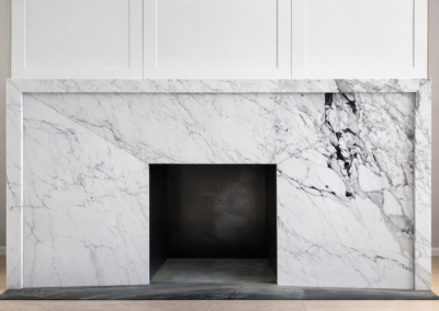 Breccia Capraia marble fireplace surround with bold burgundy veining installed in a luxury residential interior in London